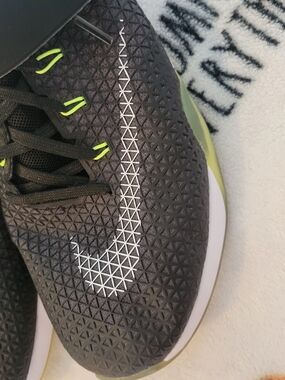 Nike Black Athletic Sneakers with White Swoosh and Lime Accents